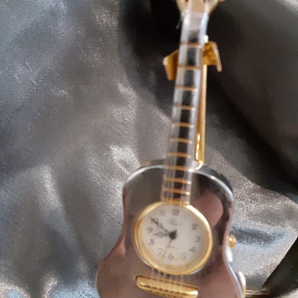 Vintage antique silver colored guitar watch